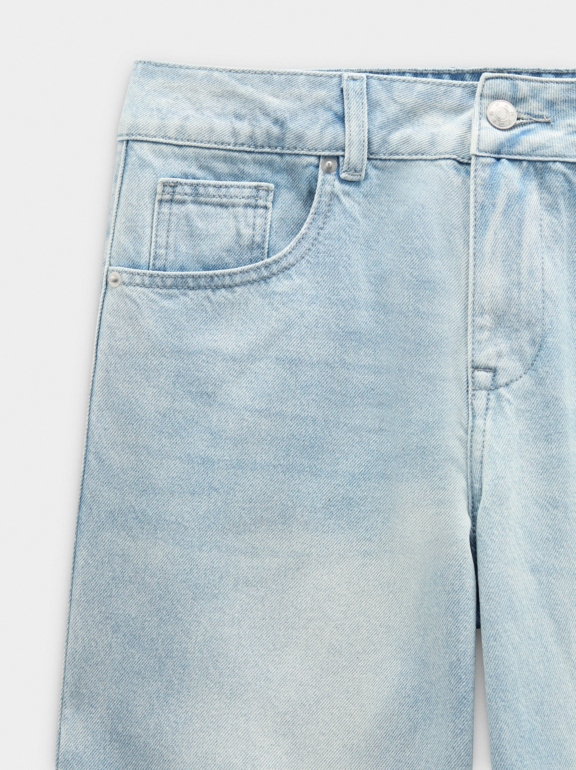 Distressed denim jeans