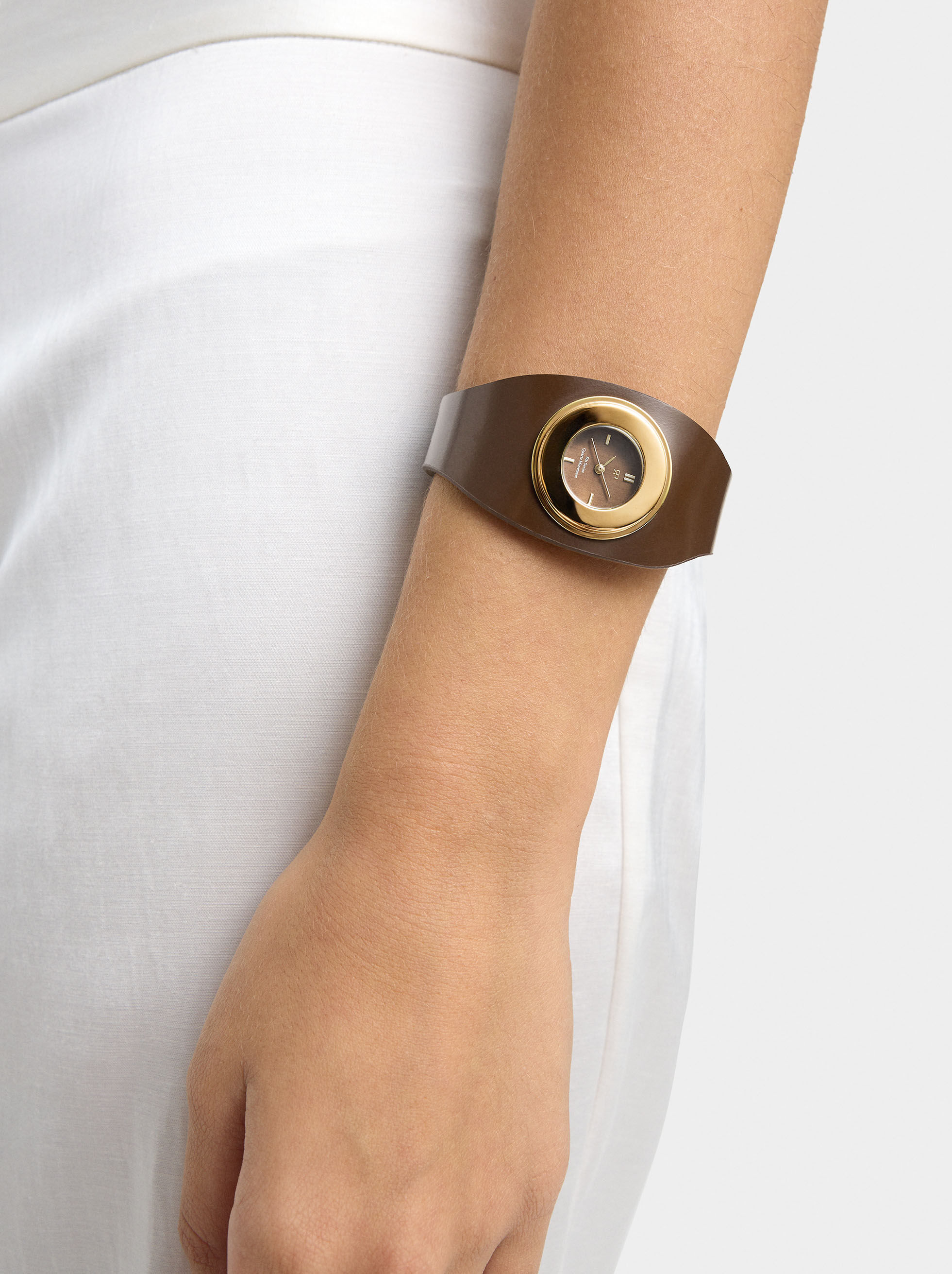 Wide bracelet watch with skin effect