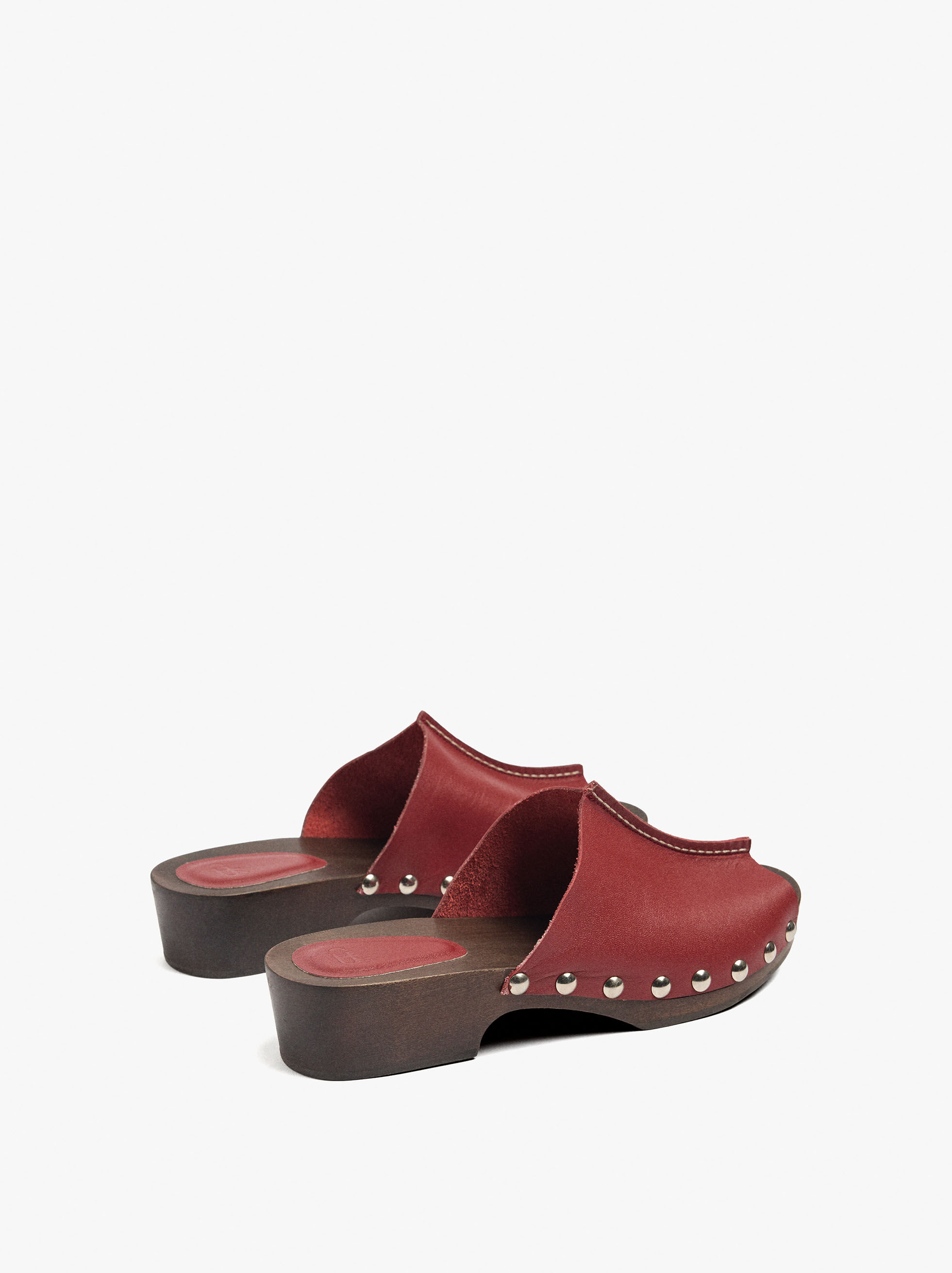 Leather mules with metal studs